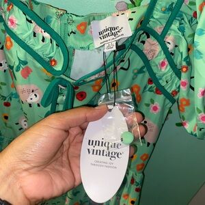 Unique Vintage 1940s Green Possum Print Button Front Dress